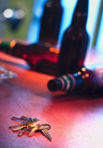 Picture shows keys and beer bottles, possible drink driving